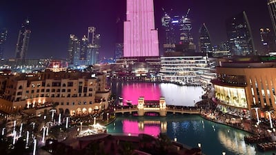 A picture taken on March 29, 2018 shows a laser show on the Burj Khalifa, the tallest tower in the world, in downtown Dubai. (Photo by GIUSEPPE CACACE / AFP)