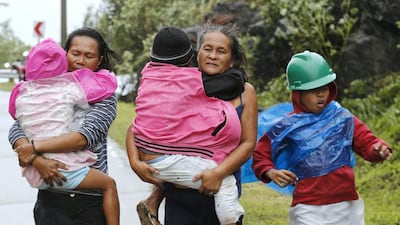 Residents evacuate to safer ground in the town of Marabot on Samar island before Typhoon Hagupit hit the Philippines on December 6, 2014. Francis R Malasig / EPA