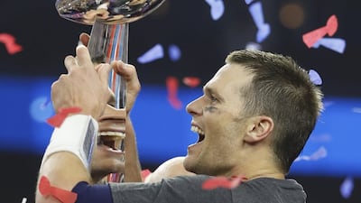 New England Patriots' quarterback Tom Brady is reflected multiple times in the Vince Lombardi trophy as he celebrates after his team defeated the Atlanta Falcons to win Super Bowl LI in Houston, Texas, US, February 5, 2017. Robert Seale / Reuters