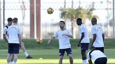 Bernardo Silva, centre, takes part in training in Abu Dhabi for Manchester City. Chris Whiteoak / The National