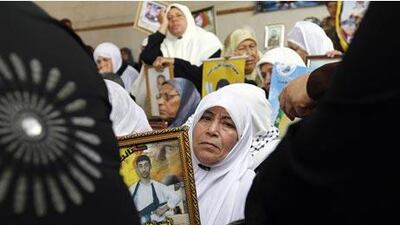 Palestinian women attend a rally at the Red Cross offices in Gaza City to call for the release of Palestinian prisoners held in Israeli jails.