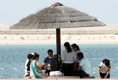 Residents spend time at Al Mamzar Beach in Dubai. Pawan Singh / The National
