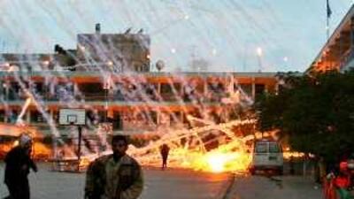 A UN school is hit during Israeli strikes last year. Amnesty International claims Israel used white phosphorous bombs during the offensive.