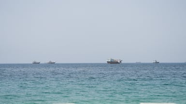 Vessels near the Strait of Hormuz, as seen from Musandam, Oman, August 6, 2026. REUTERS / Stringer