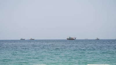 Vessels near the Strait of Hormuz, as seen from Musandam, Oman, August 6, 2026. REUTERS / Stringer