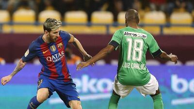 Lionel Messitakes on Al Ahli’s Luiz Carlos. Karim Jaafar / AFP
