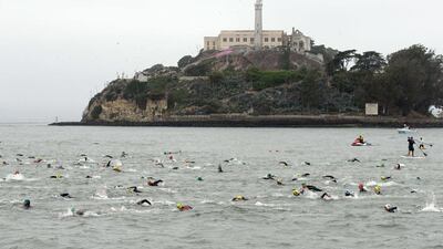 Competitors swim past Alcatraz at the start of the 34th Escape from Alcatraz Triathlon on Sunday in San Francisco, California. Ezra Shaw / Getty Images / AFP / June 1, 2014