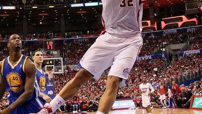 Blake Griffin of the Los Angeles Clippers dunks against the Golden State Warriors during their Game 2 win on Monday night in the Western Conference quarter-finals. Stephen Dunn / Getty Images / AFP / April 21, 2014
