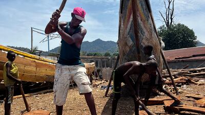 A father and son building a boat. Nick Webster / The National