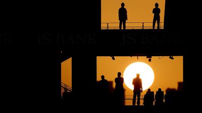 Fans attend the fourth one day international cricket match between Pakistan and Australia at Dubai International Stadium in Dubai. AFP
