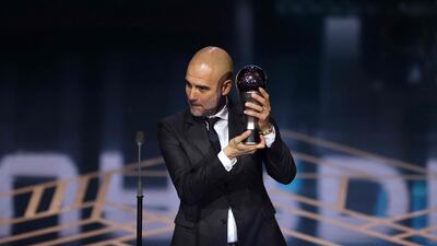 Manchester City coach Pep Guardiola receives The Best Fifa Men's Coach award. AFP