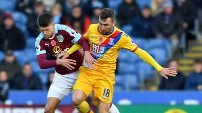 Burnley's Johann Berg Gudmundsson, left, and Crystal Palace's James McArthur. Dave Howarth / AP