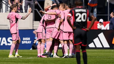 DC United striker Christian Benteke watches as Inter Miami celebrate a goal during the first half. AP