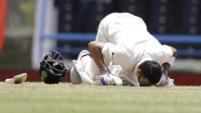 Kohli kisses the field after scoring a double century. (AP Photo/Ricardo Mazalan)