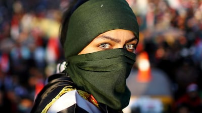 An Iraqi female demonstrator takes part in ongoing anti-government protests in Baghdad, Iraq. Reuters