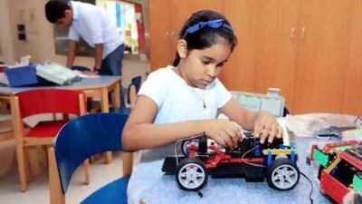 Dana Dias, 7, enjoying a robotics course in Dubai. It is hoped the course will inspire the next generation of inventors and technicians. Sarah Dea / The National