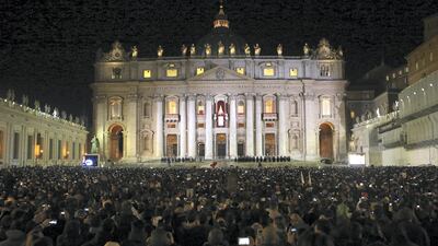 Pope Francis waves to the waiting crowd after being elected pope. Getty Images