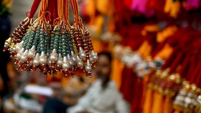 The ritual is not limited to siblings as cousins, friends and even colleagues tie rakhis. AFP