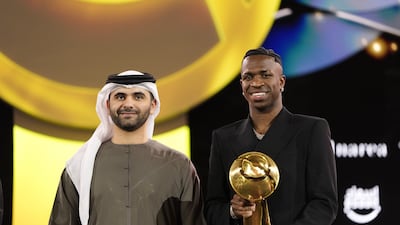 Real Madrid's Vinicius Junior receives the player of the year award at the Dubai Globe Soccer Awards. AP