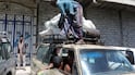 A man loads sacks of flour amid shortages in Taiz, Yemen, as clashes between government troops and the Houthi rebels continue. Reuters