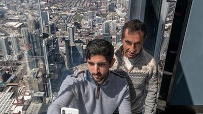 Sheikh Hamdan captures the view from the Willis Tower, once the tallest building in the world, with his uncle Saeed.