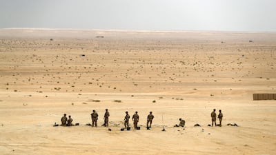American troops prepare for the live-fire exercise in the Abu Dhabi desert. Chris Whiteoak / The National
