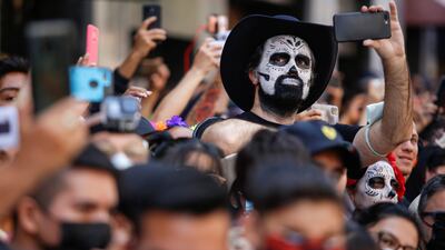 A man with a skull face painting attends the annual Day of the Dead parade in Mexico City. Reuters