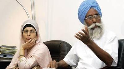 Piarelal, 73, a private English tutor and retired school clerk, with Mukhwinder Singh, the mother of Harjinder Singh, one of the 17 Indian men pardoned for a bootleg murder in Sharjah. Courtesy of Sprocket Science Films