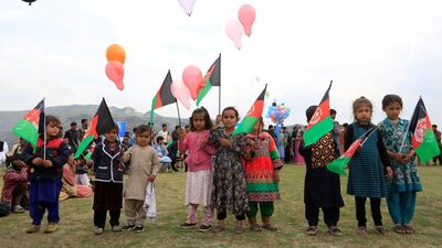 Afghan children celebrate in anticipation of the U.S-Taliban agreement to allow a U.S. troop reduction and a permanent ceasefire, in Jalalabad, Afghanistan. REUTERS