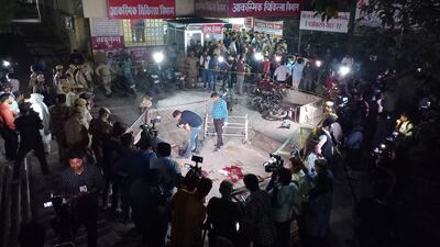 Indian police officers survey the scene where former MP Atiq Ahmed and his brother Ashraf were killed in Prayagraj, Uttar Pradesh. EPA