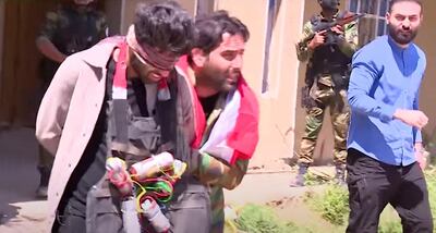 Iraqi footballer Alaa Mhawi with a fake bomb strapped to his chest.