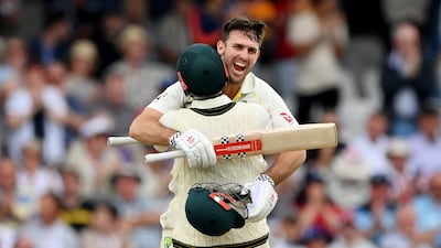 Mitchell Marsh of Australia celebrates with Travis Head after reaching his century during day one of the Headingley Test against England on Thursday, July 6, 2023. Getty