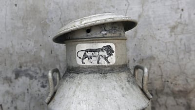 A 'Make In India' sticker is seen on a an empty milk urn at a cow shelter where urine is collected and processed in Bulandshahar, Uttar Pradesh, on June 17, 2016. Anindito Mukherjee/Bloomberg