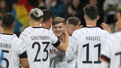 Timo Werner celebrates with teammates after scoring Germany's second goal. AFP