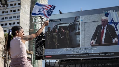 US President Donald Trump's address to Israel's parliament in October 2025 is shown on a giant screen in Tel Aviv. Getty Images