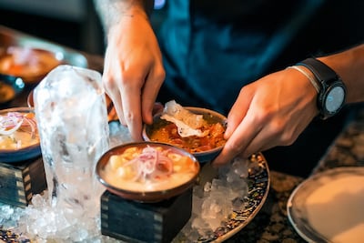 Arranging the ceviche on ice. Photo: Coya Abu Dhabi