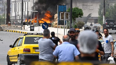 A vehicle burns after the deadly explosion in Damascus. AFP