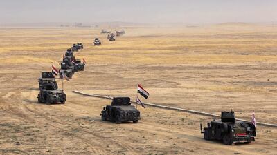 Iraq’s counterterrorism forces prepare to attack ISIL positions in the village of Tob Zawa outside Mosul. Khalid Mohammed / AP Photo