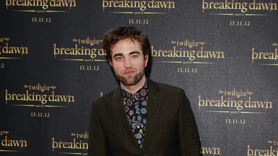In a brown suit and patterned shirt at a 'Twiight Saga: Breaking Dawn – Part 2' fan event in Sydney, Australia on October 22, 2012. Getty Images