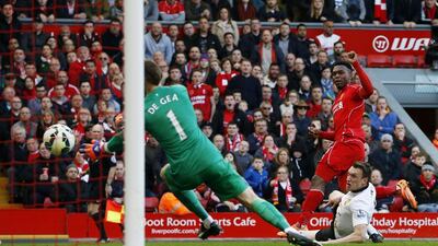 Daniel Sturridge scores Liverpool's lone goal past Manchester United keeper David de Gea on Sunday in his side's 2-1 Premier League loss. Phil Noble / Reuters