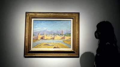 The painting by Winston Churchill shows the 12th-century mosque in Marrakesh at sunset with the Atlas Mountains in the background. AP