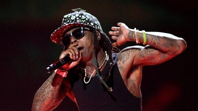 Rapper Lil Wayne has reportedly suffered seizures causing him to cancel his Vegas gig. Steve Marcus / Reuters