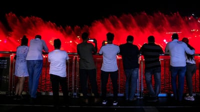 People gather to watch the fountain display in Palm Jumeirah. Reem Mohammed / The National