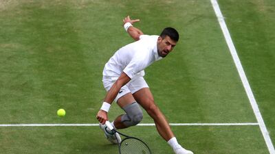 Novak Djokovic of Serbia plays a backhand against Lorenzo Musetti of Italy in their semi-final. Getty Images