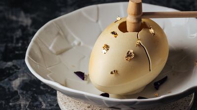 The cheesecake is ensconced in an edible egg.