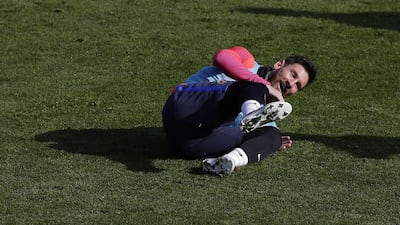 Lionel Messi smiles during a training session. Manu Fernandez / AP