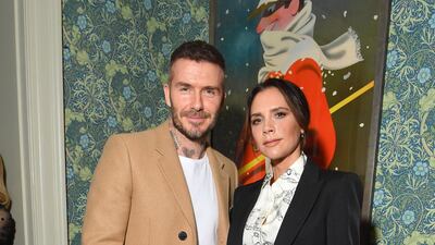 Victoria and David Beckham, in a camel coat and white tee, attend the Victoria Beckham x YouTube after-party at Marks Club on February 17, 2019 in London, England. Getty Images
