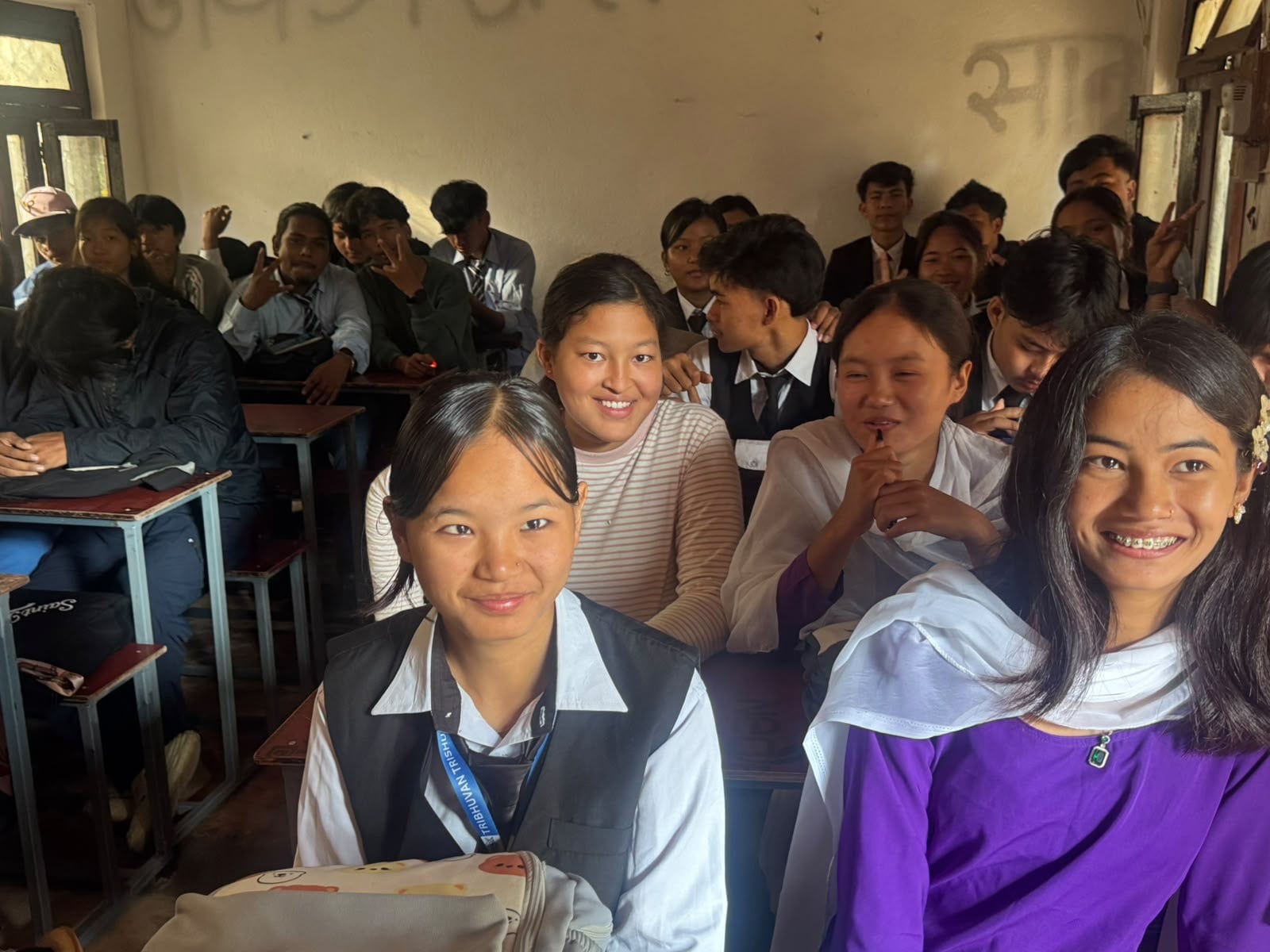 Pupils express their happiness at heading back to school after the floods killed family and friends and destroyed their homes. Photo: Rajendra Dawadi