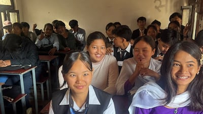Pupils express their happiness at heading back to school after the floods killed family and friends and destroyed their homes. Photo: Rajendra Dawadi