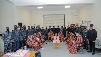 Egyptian Navy officials with the crew of the Lebanon-registered 'Ayla', a cargo ship that capsized in the Mediterranean Sea. Photo: Egyptian Armed Forces